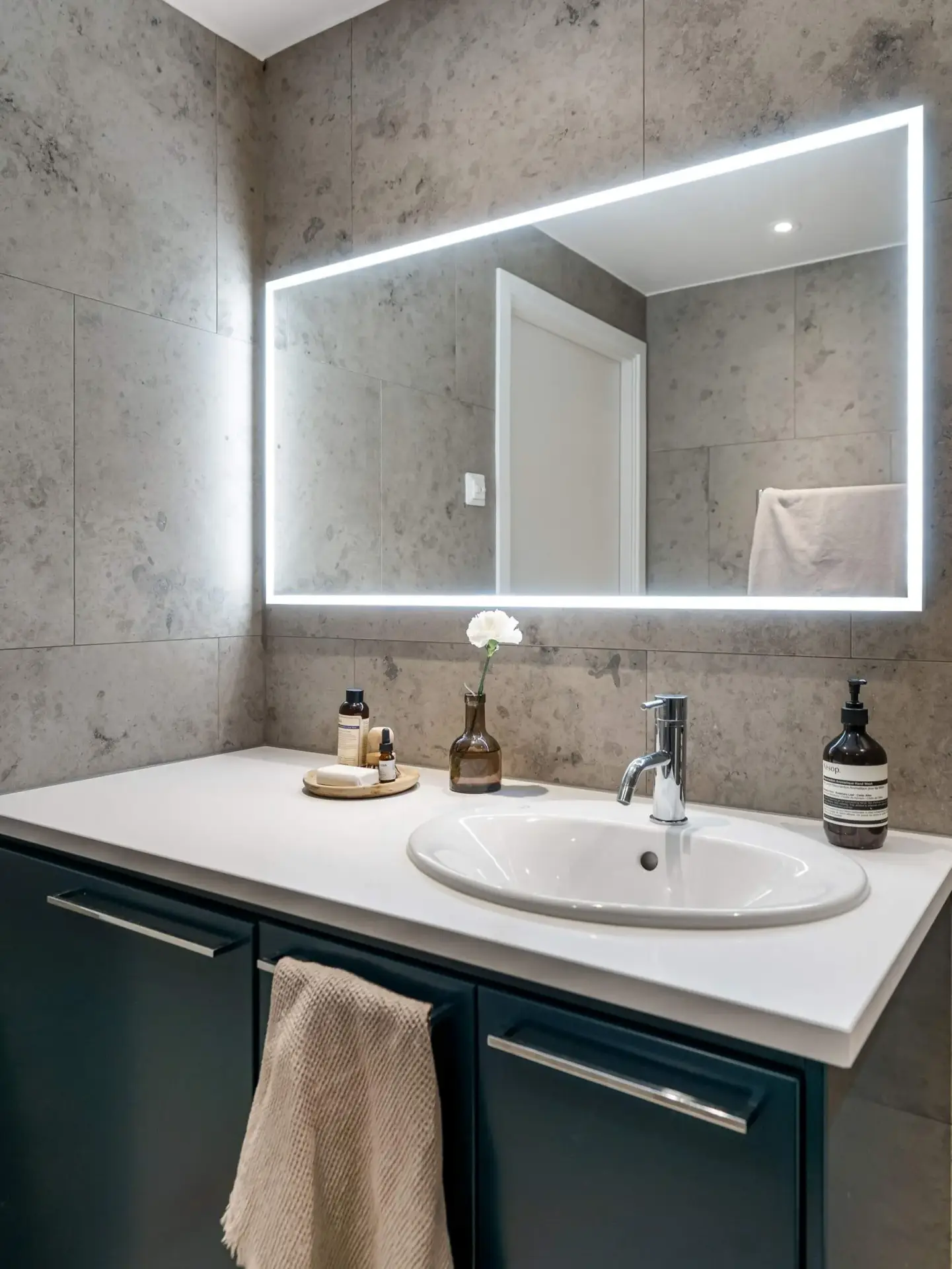 Custom NISSIYA LED bathroom mirror solution installed in a luxury hospitality guest suite