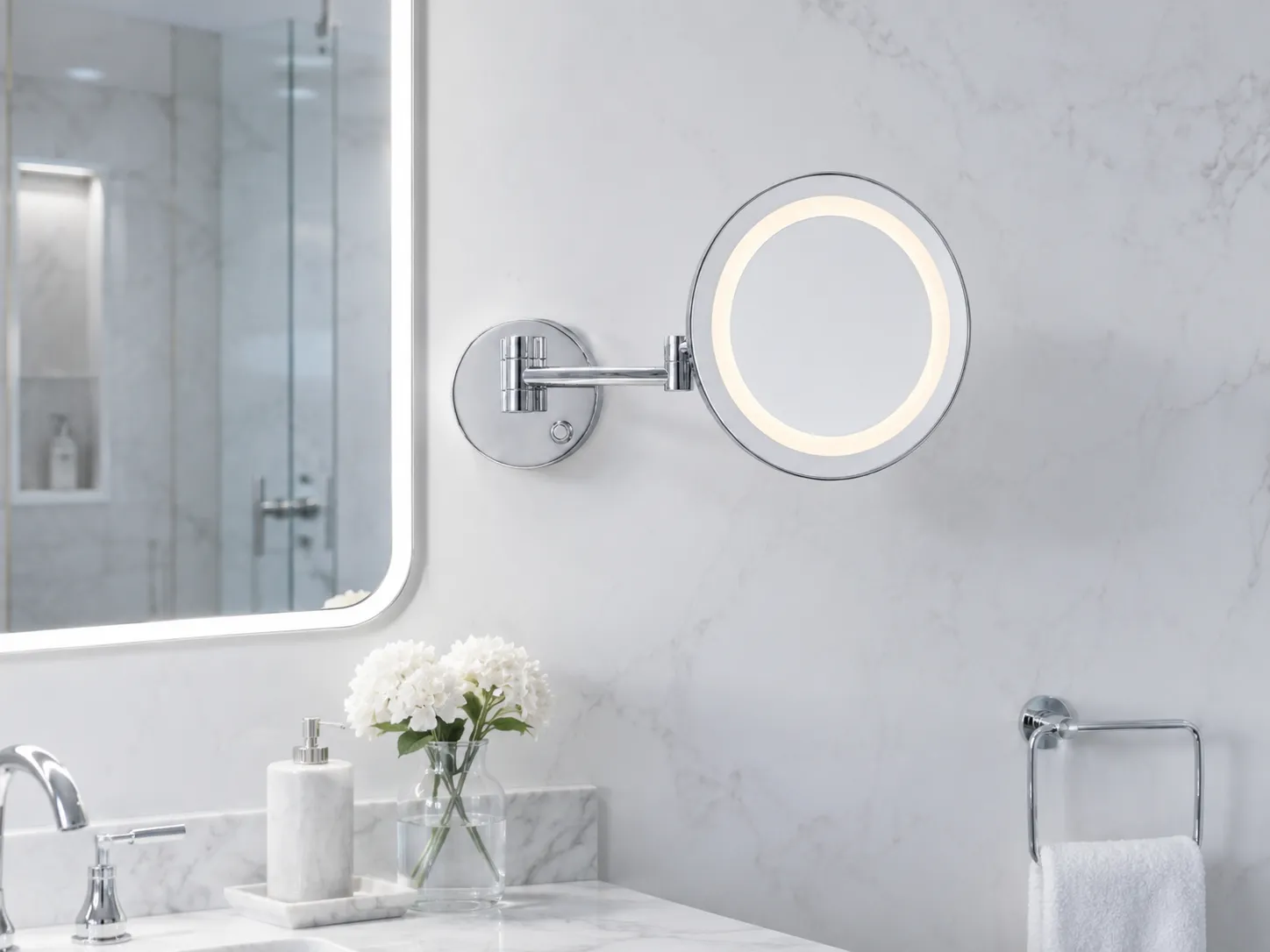 9-inch wall-mounted LED makeup mirror with 3X magnification in a bright hotel bathroom