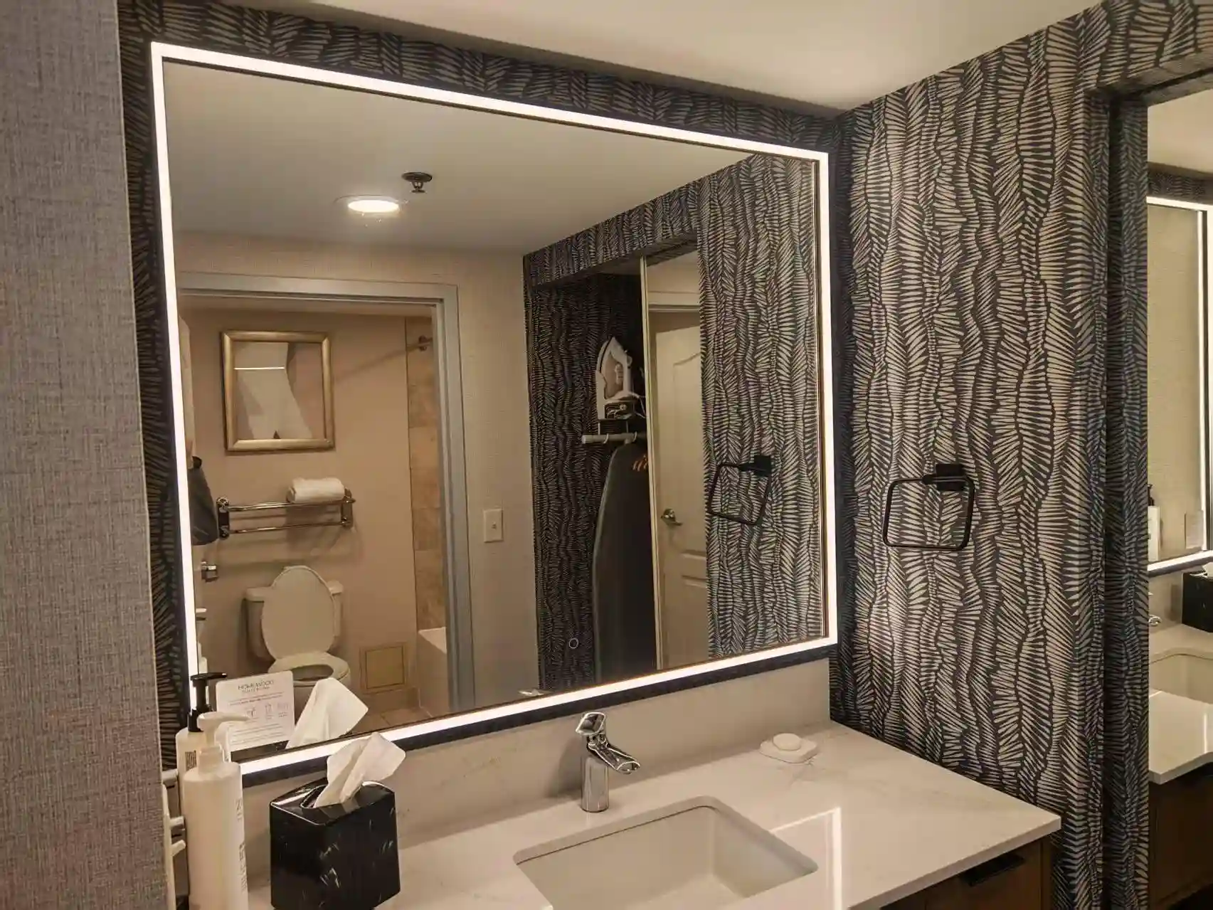 LED bathroom mirror installed in a hotel bathroom project